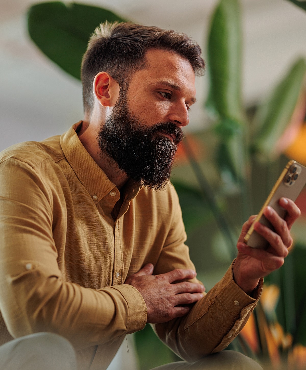 Laboratory technician holding test tubes in rack.