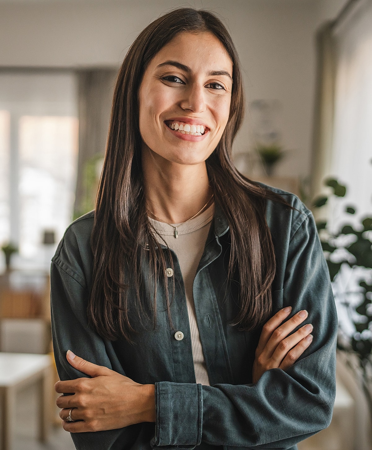 Person meditating by the sea at sunset.